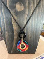 large mixed tone, resin pendant and earring set