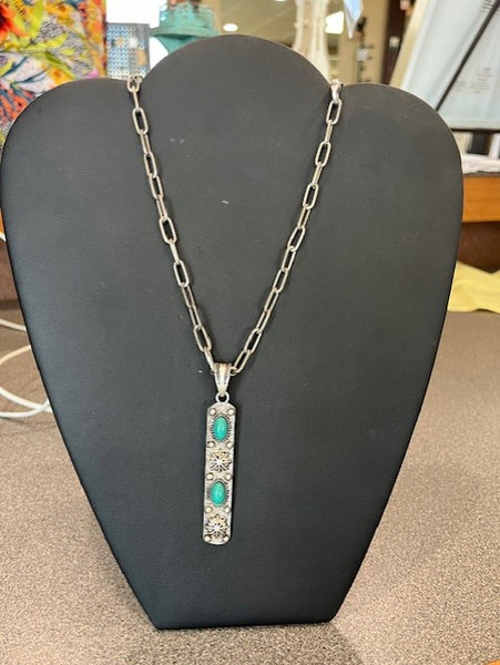 Silver vertical pendant with 2 turquoise stones on a silver chain