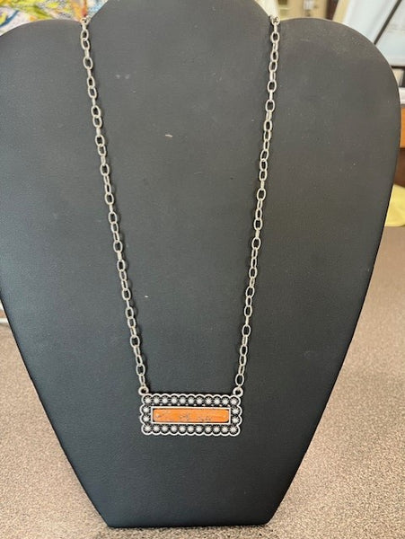 silver chain necklace with orange horizontal bar pendant