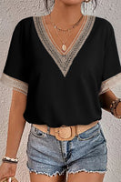 women's Black, short sleeve blouse with tan trim at vneck and sleeves