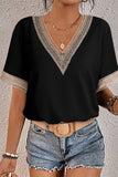 women's Black, short sleeve blouse with tan trim at vneck and sleeves