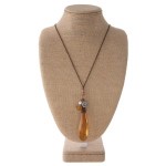 long necklace with faceted topaz crystal pendant