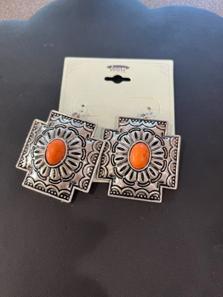 large concho earring with orange stone center