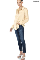 Women's long sleeve cream colored blouse
